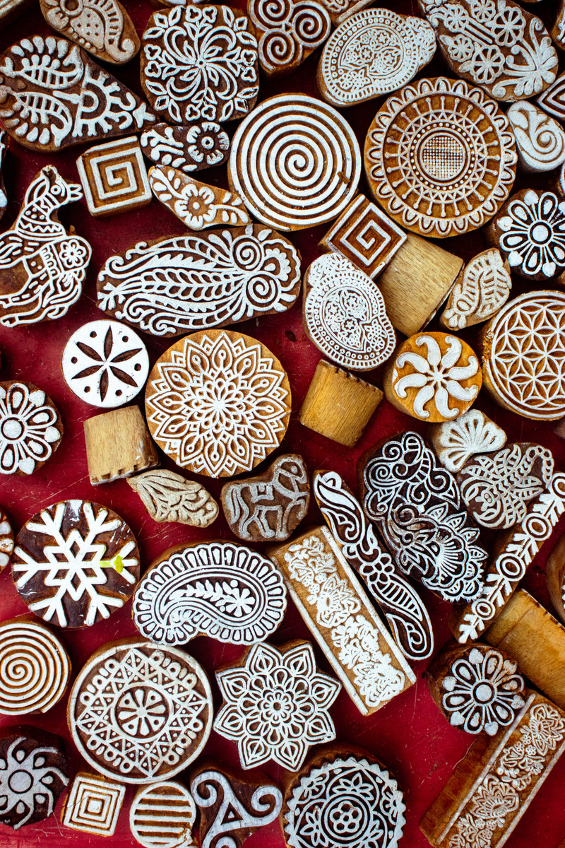 Carved wooden printing blocks on red.