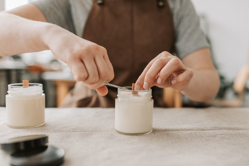 Setting the wooden wick in a fresh candle.