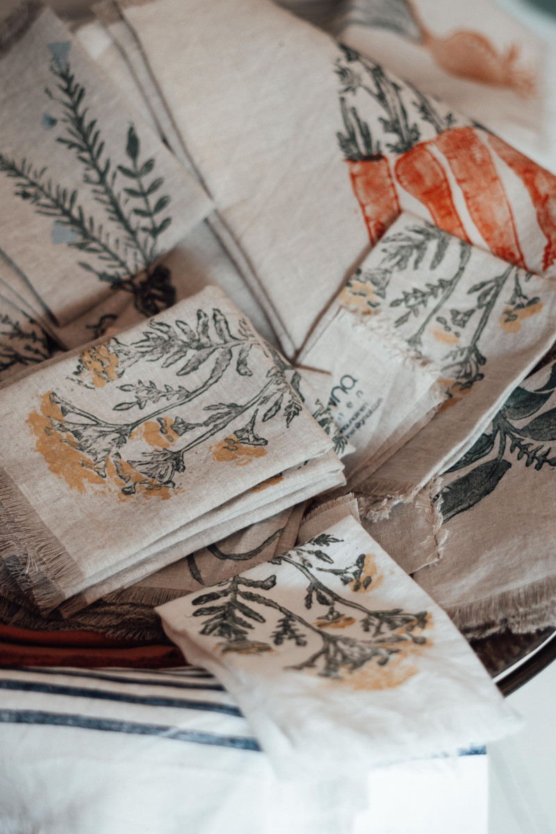 Block-printed linen napkins with fringes.