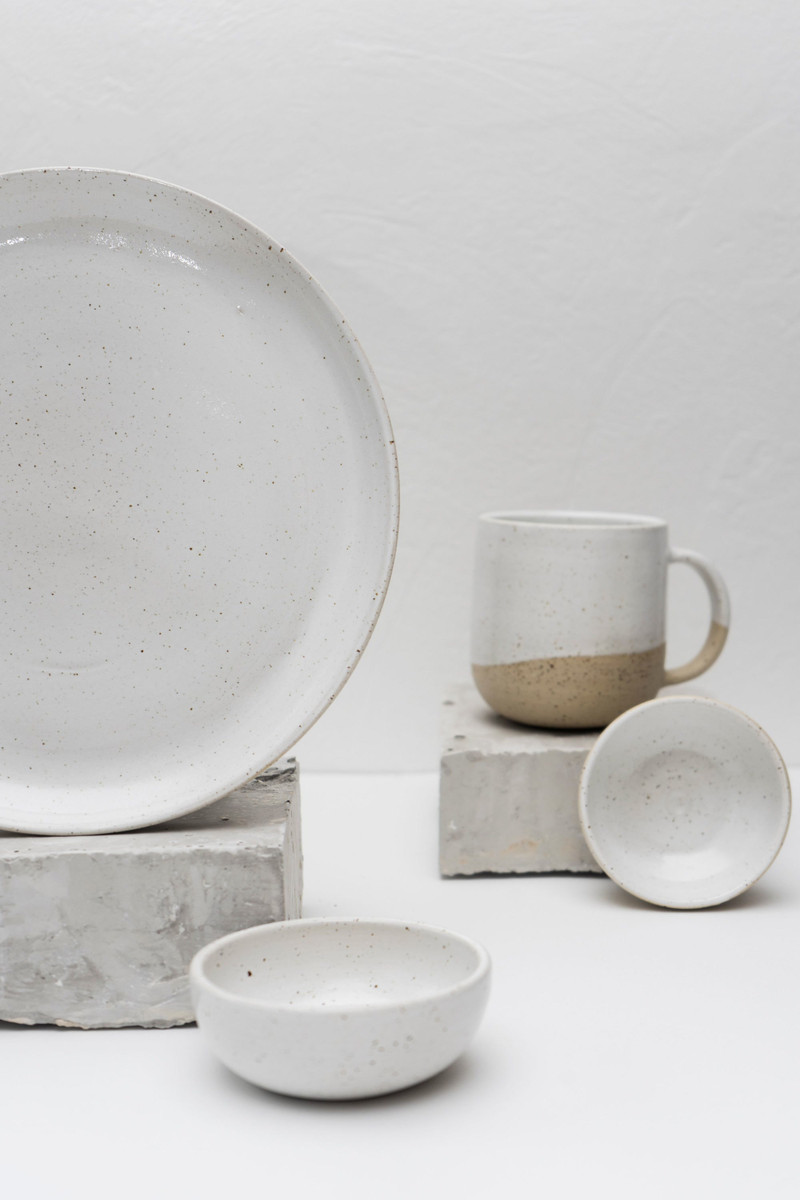 A white stoneware bowl, plate and mug.