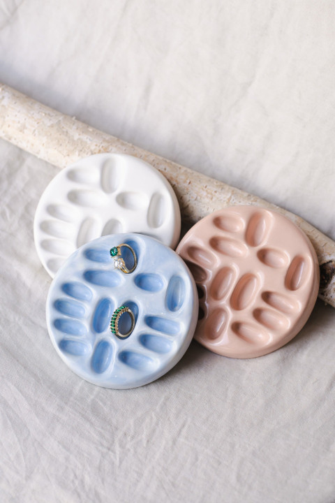 Pastel ceramic trinket dishes with rings.